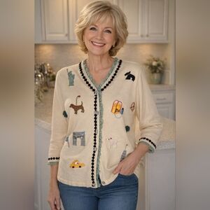 Storybook Knits Cream Sweater with New York City Embroidered Motifs